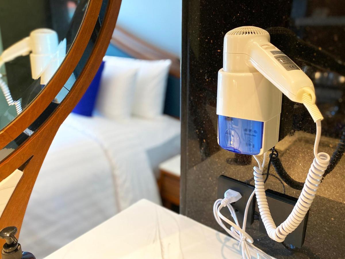 The Oceanic Sportel Phuket - Sha Extra Plus Exterior photo A hair dryer mounted on a wall